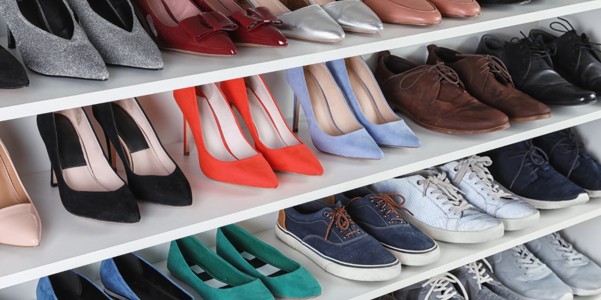 Multiple pairs of shoes on shelf